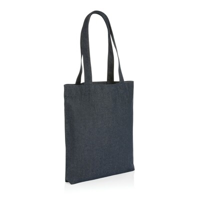 The Impact AWARE™ recycled denim tote 320gsm  is the perfect way to carry your essentials in style. This spacious tote provides sufficient space for your tech accessories and other daily needs. With AWARE™ tracer that validates the genuine use of recycled